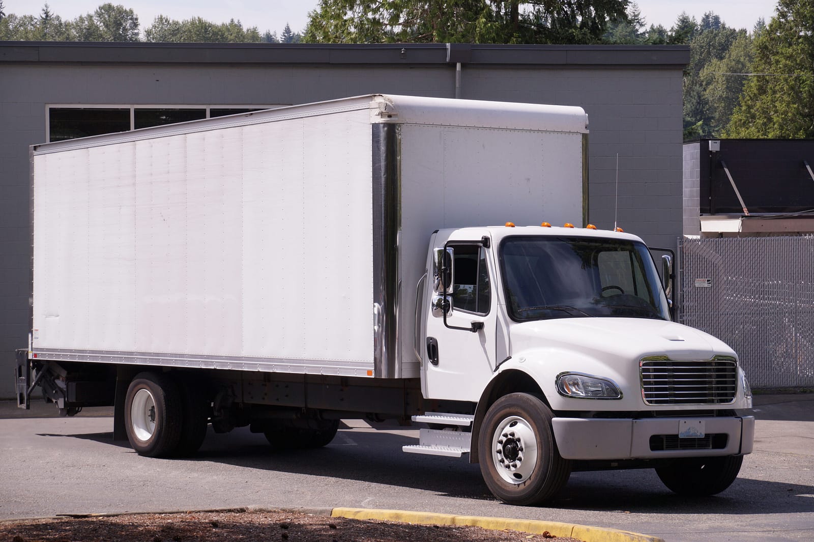 Rigid truck parked at a work yard - truck leasing in Australia
