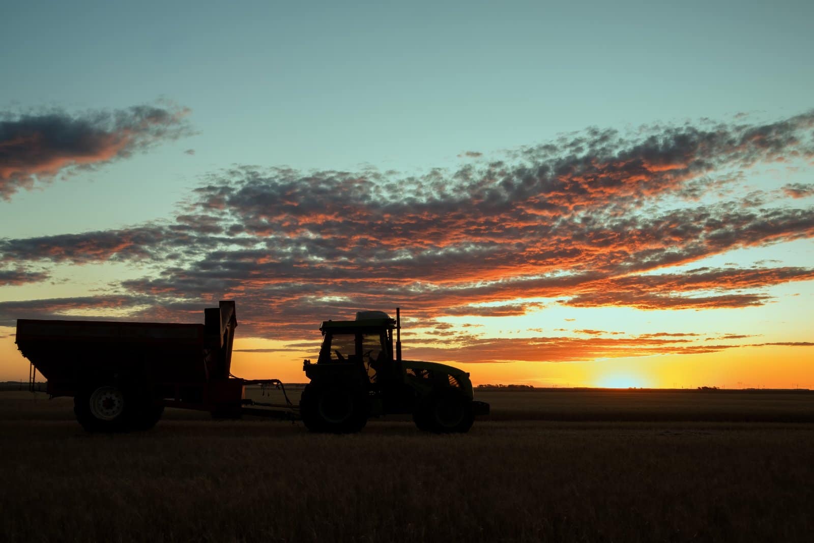 Tractor and grain cart in an Australian farm paddock — farm equipment finance