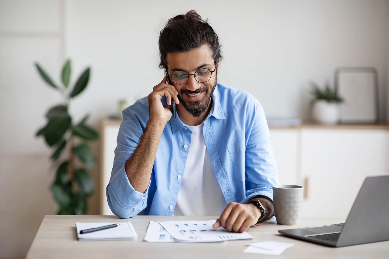 Self-employed tradesperson reviewing personal loan paperwork at home