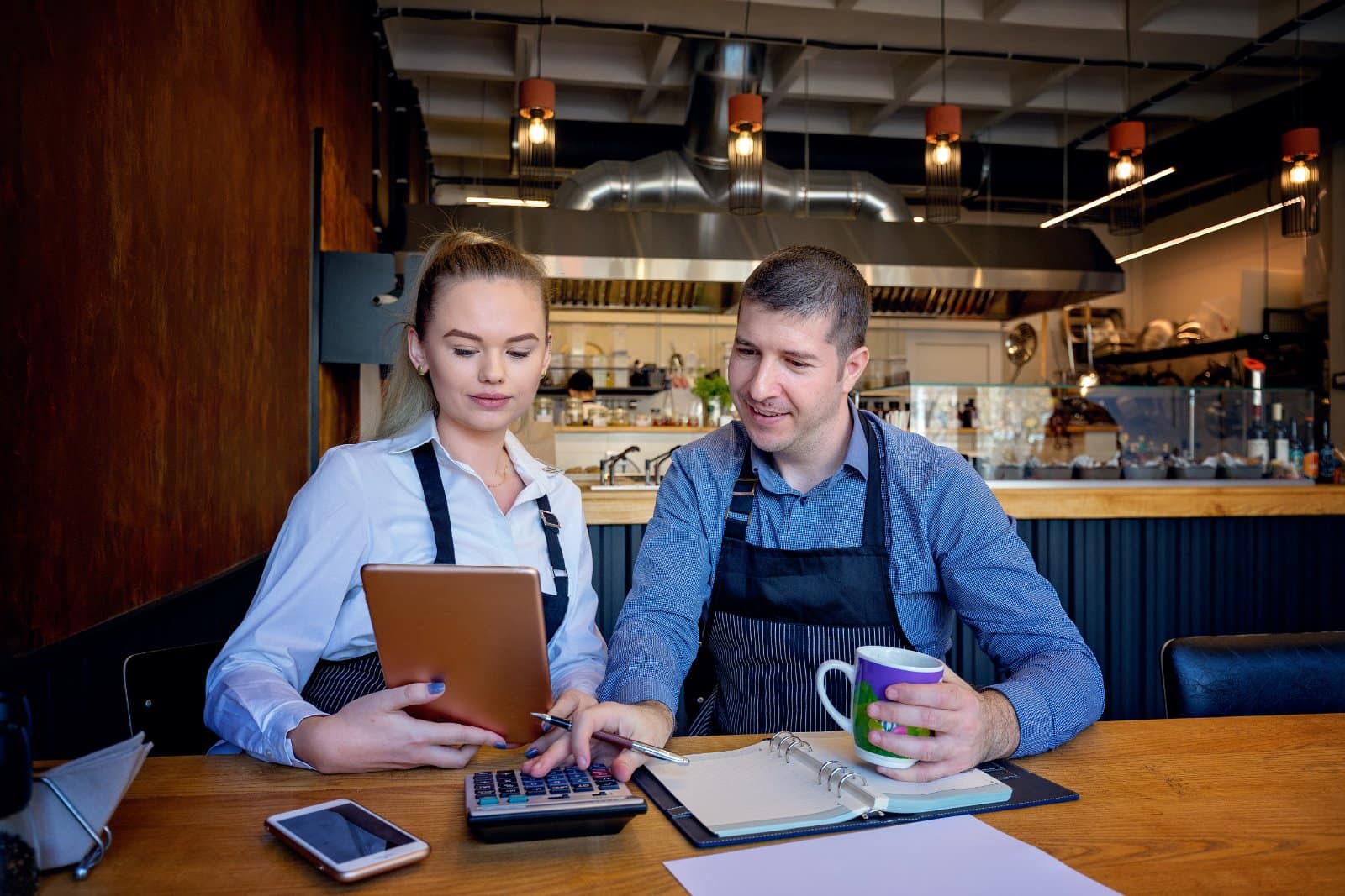 Small business owners reviewing cash-flow reports