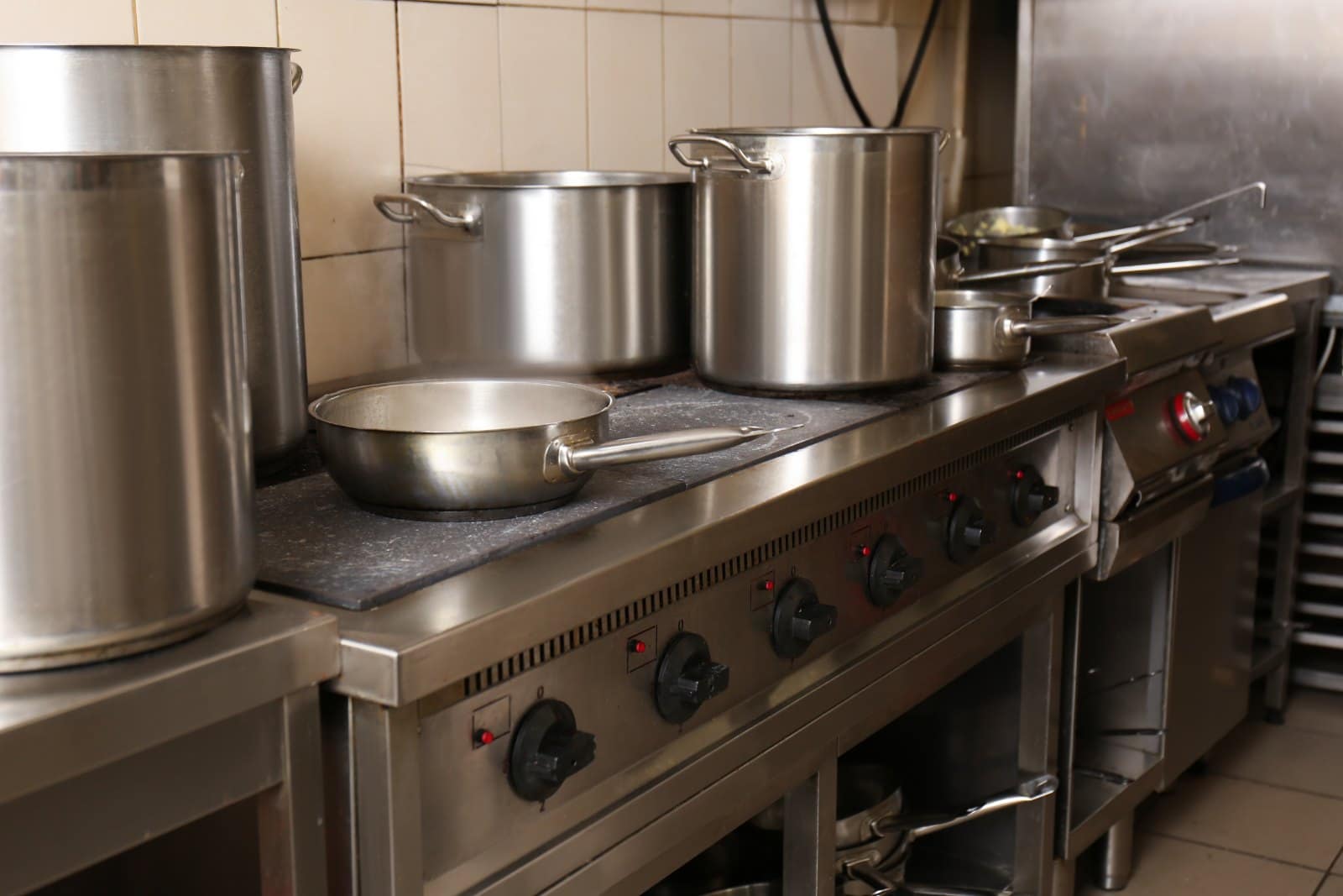 Commercial kitchen with stainless steel cooking equipment in an Australian hospitality venue