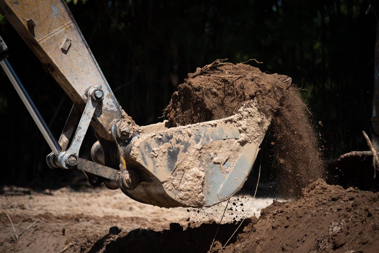 Yellow excavator during earthmoving works on an Australian construction site