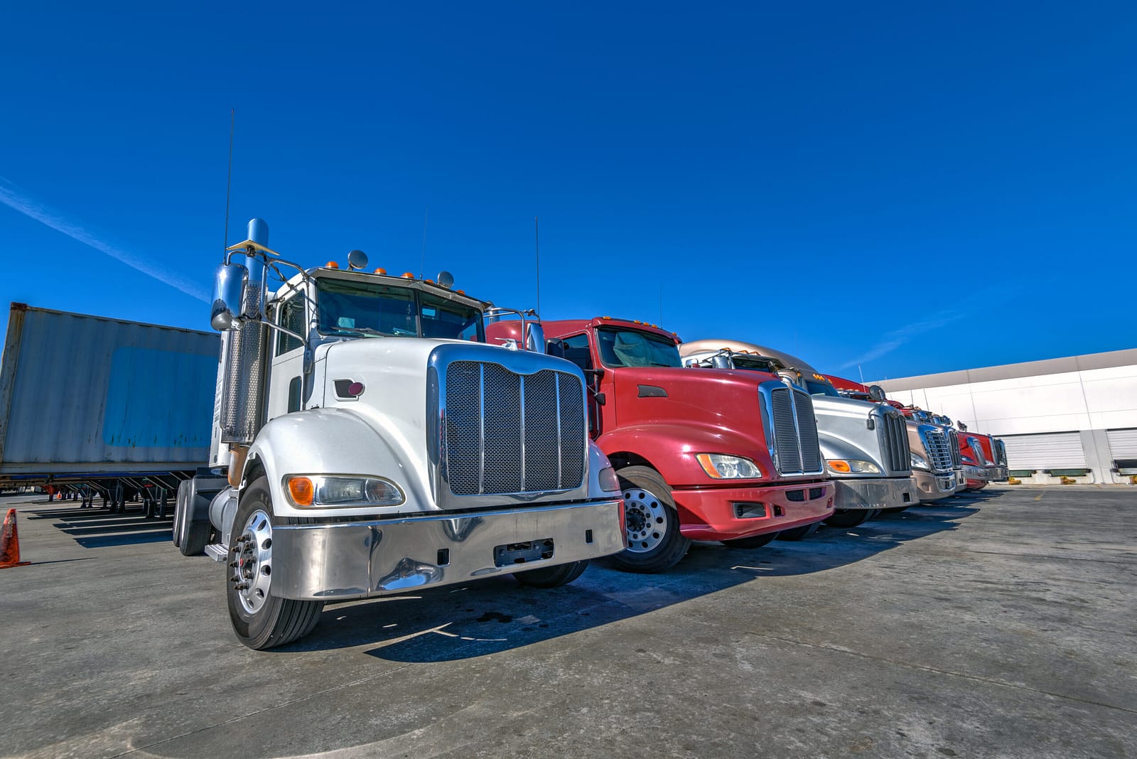 Semi trucks lined up at a depot — used truck finance Australia