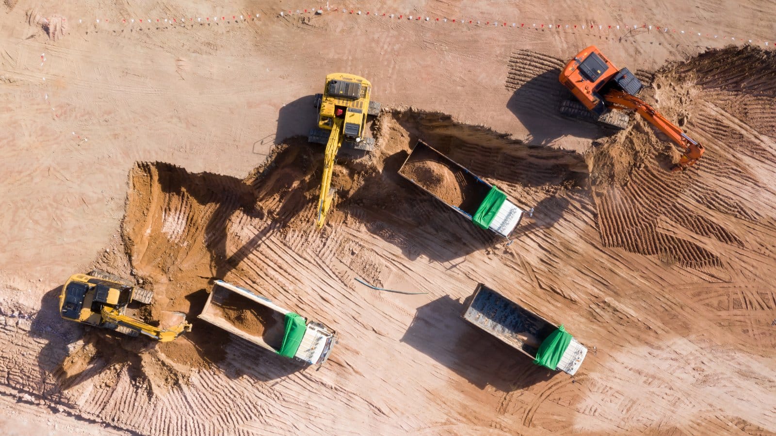 Excavator and dump truck working together on an Australian construction site